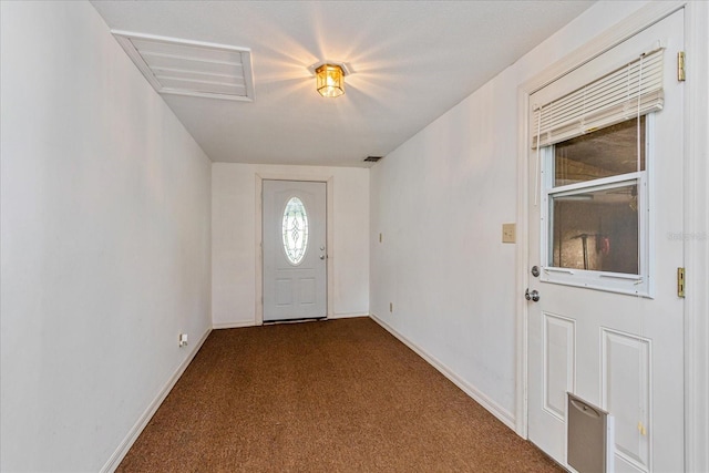 view of carpeted entrance foyer