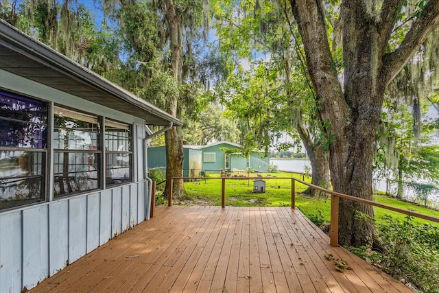 wooden deck with a yard