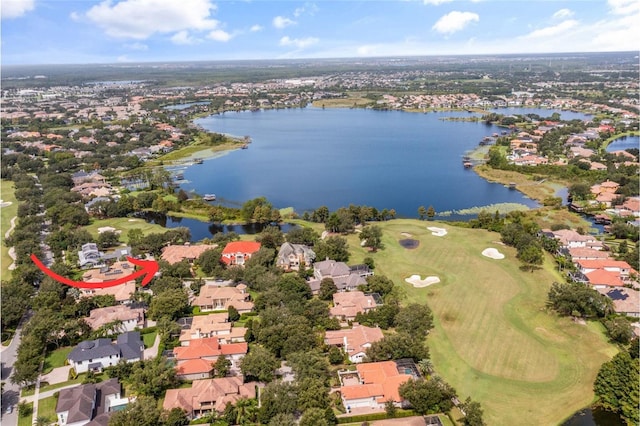 aerial view featuring view of golf course, a water view, and a residential view