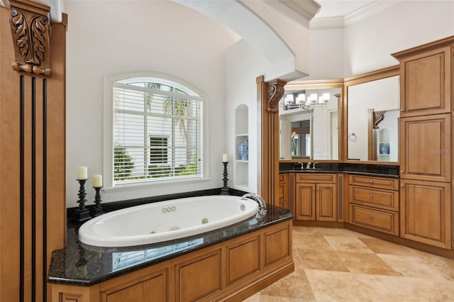 full bath with crown molding, vanity, and a whirlpool tub