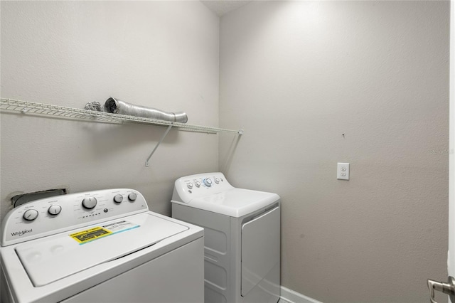 laundry area with washing machine and dryer and laundry area