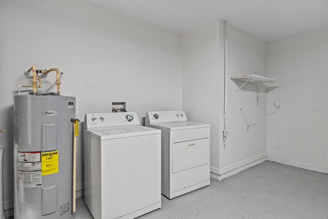 washroom with electric water heater and washing machine and dryer