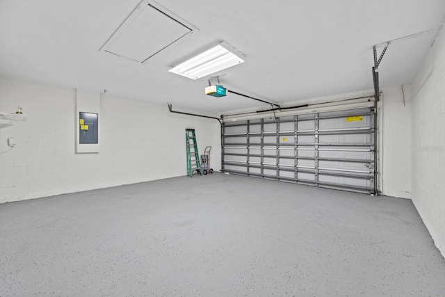 garage featuring electric panel and a garage door opener