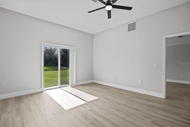 unfurnished room with ceiling fan, light hardwood / wood-style floors, and a textured ceiling