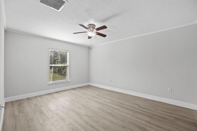 empty room featuring a textured ceiling, ceiling fan, and light wood-type flooring