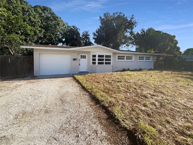 single story home featuring a garage