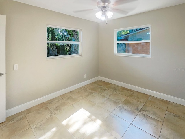 unfurnished room featuring light tile patterned floors and ceiling fan