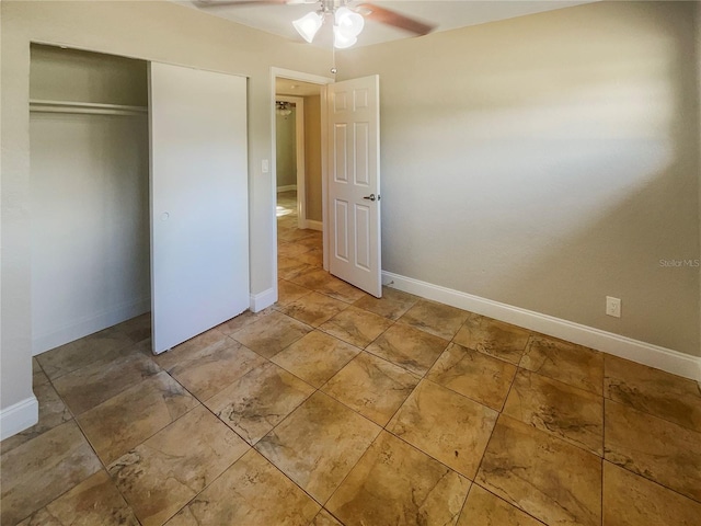 unfurnished bedroom featuring tile patterned floors, a closet, and ceiling fan