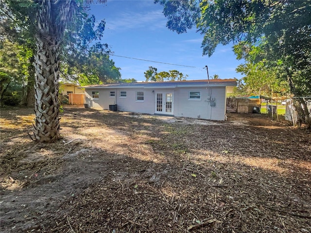 back of house with french doors and central AC