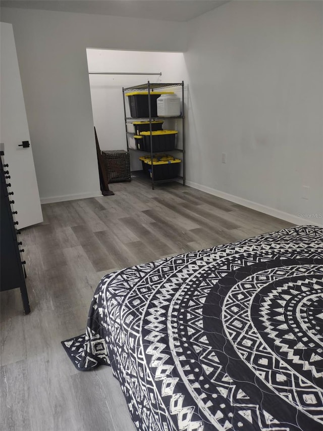 bedroom featuring wood-type flooring