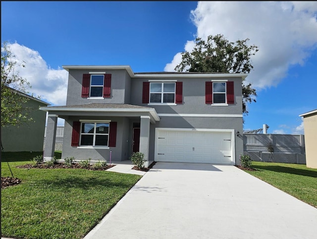 view of front of house featuring a garage and a front yard