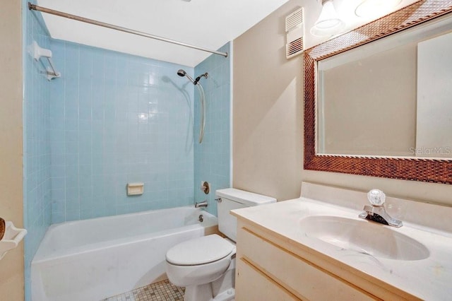 full bathroom featuring vanity, toilet, and tiled shower / bath