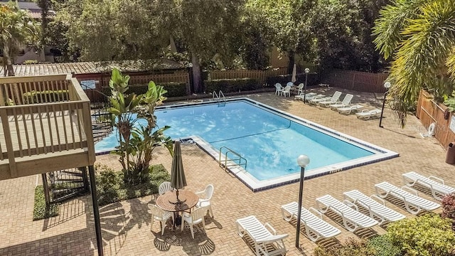 view of swimming pool featuring a patio area