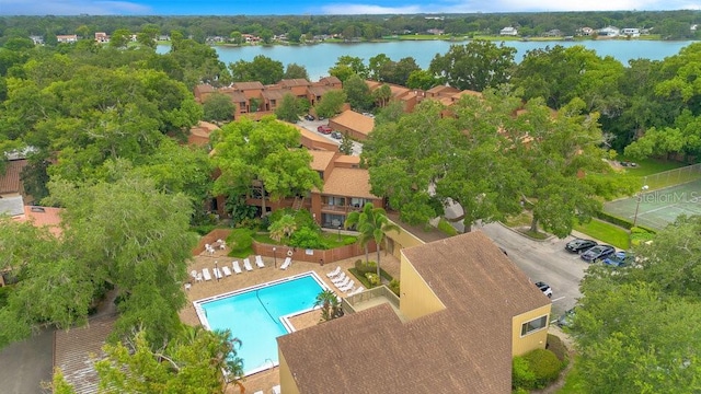 birds eye view of property with a water view