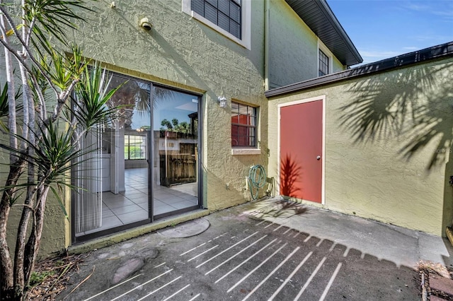 property entrance with a patio