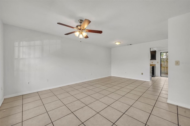 unfurnished room with ceiling fan and light tile patterned flooring