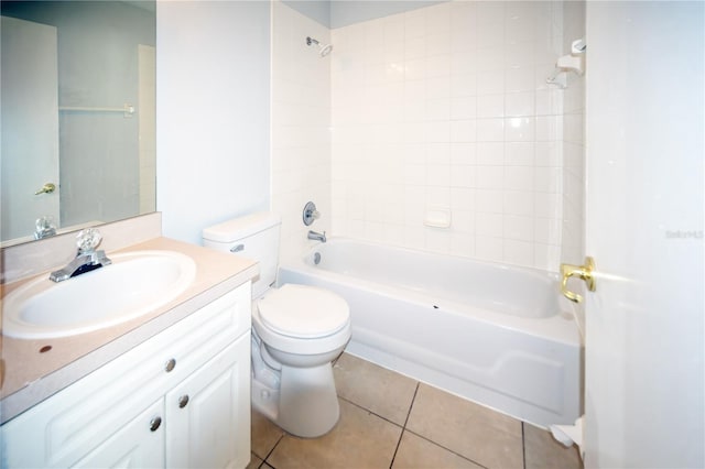 full bathroom with vanity, tile patterned flooring, tiled shower / bath, and toilet