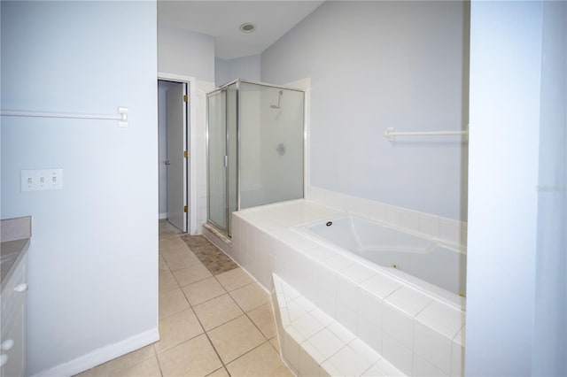 bathroom featuring vanity, tile patterned floors, and separate shower and tub