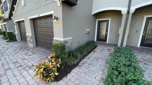 entrance to property featuring a garage