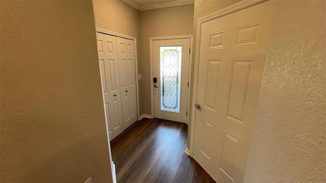 entryway featuring ornamental molding and dark wood-type flooring