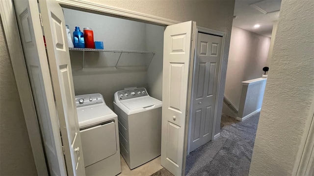 laundry room with carpet and washer and dryer