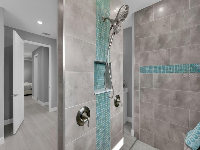 bathroom featuring tiled shower