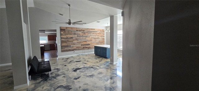 hallway featuring an inviting chandelier and vaulted ceiling