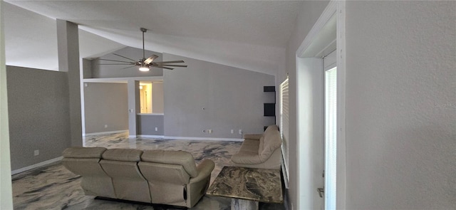 living room featuring ceiling fan and vaulted ceiling