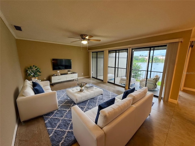 living room with crown molding and ceiling fan