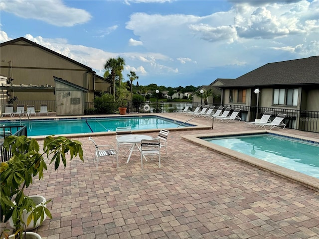 view of swimming pool featuring a patio