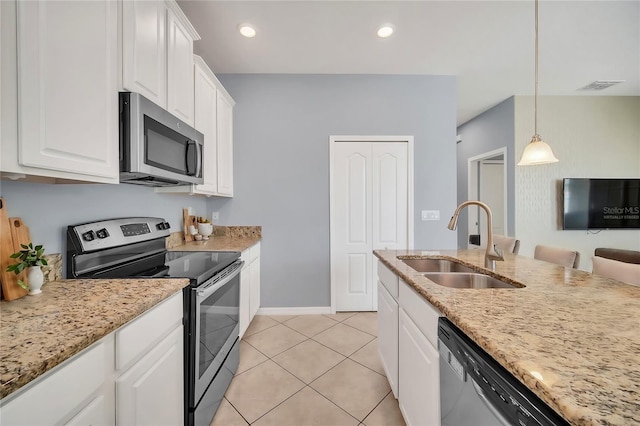 kitchen with stainless steel appliances, visible vents, white cabinetry, a sink, and light tile patterned flooring