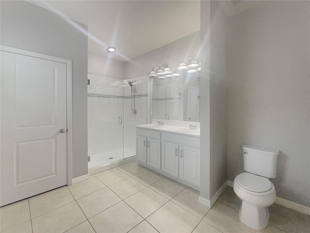 bathroom with vanity, an enclosed shower, tile patterned flooring, and toilet