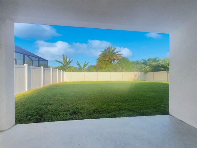 view of yard featuring a lanai