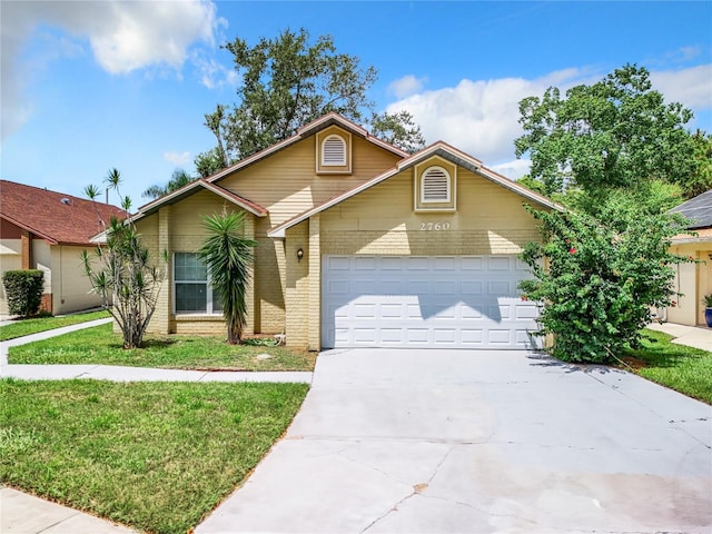 front of property with a garage and a front yard