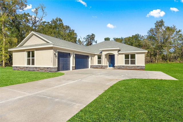 view of front of property with a garage and a front lawn