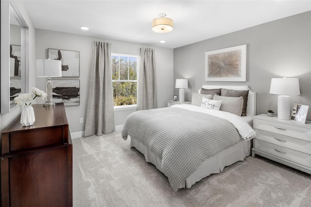 bedroom with light colored carpet