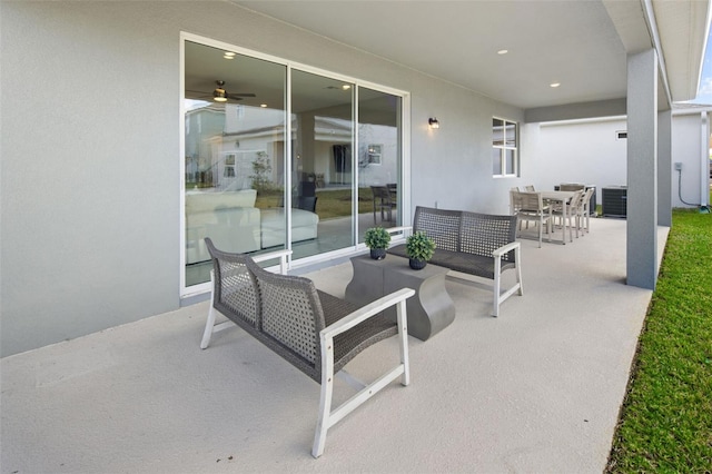 view of patio / terrace with an outdoor living space and central AC unit