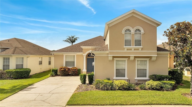 view of front of home with a front lawn