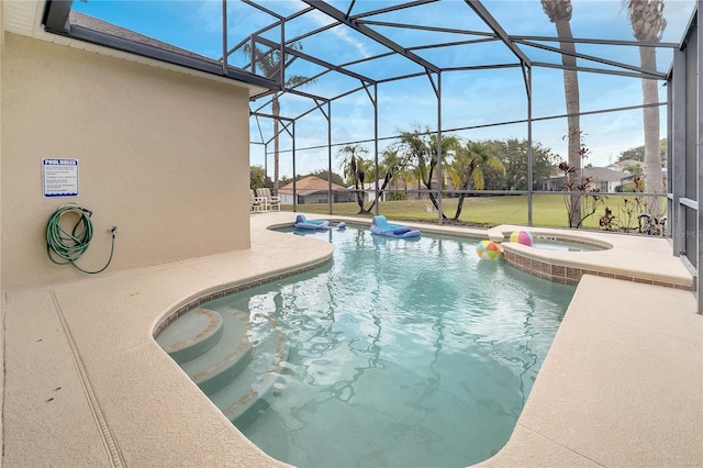 view of swimming pool featuring an in ground hot tub, a lanai, a patio, and a lawn