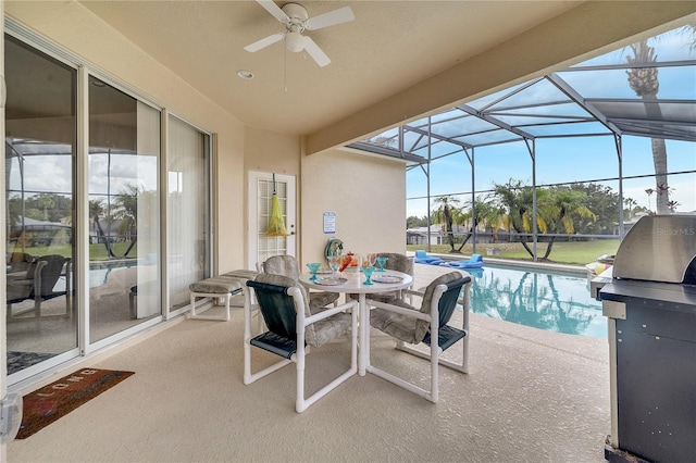 view of swimming pool featuring a grill, a patio, and glass enclosure