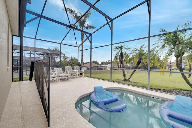 view of swimming pool featuring an outdoor hangout area, a patio area, glass enclosure, and a lawn