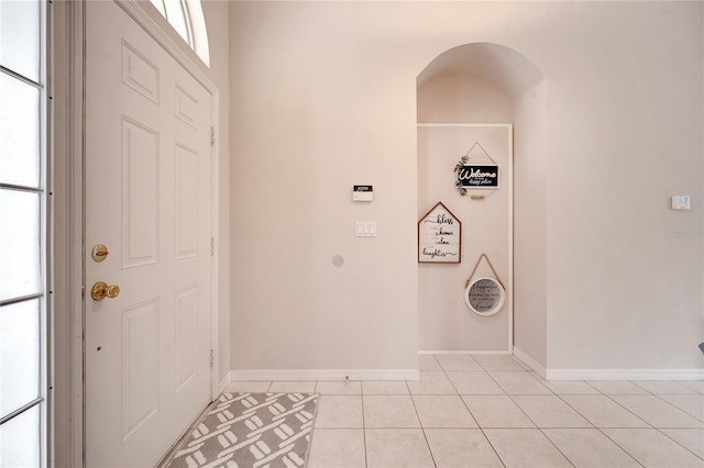 foyer featuring light tile patterned floors