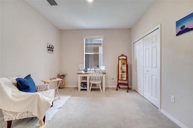 living area featuring carpet floors