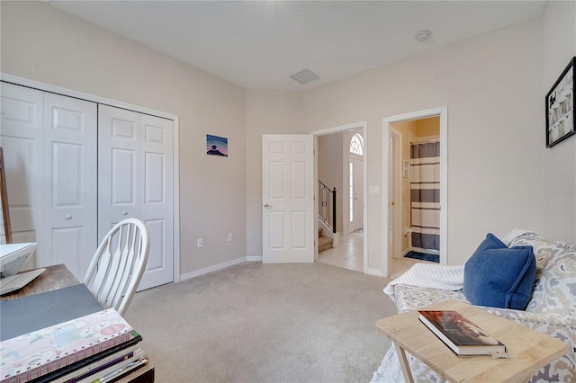 office area with light colored carpet and a textured ceiling