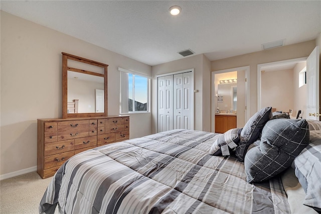 bedroom with light carpet and a closet