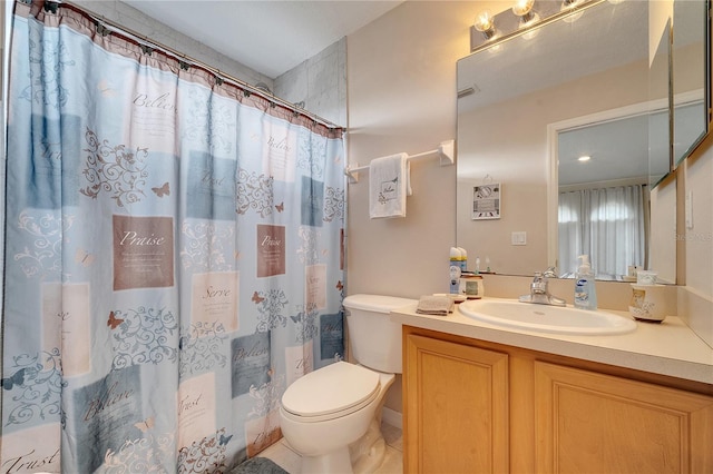 bathroom with vanity, toilet, and a shower with shower curtain