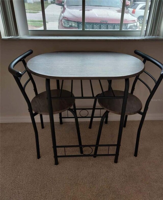 dining area with carpet