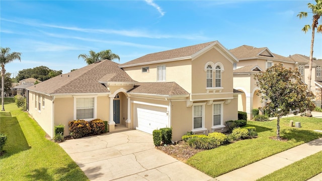 mediterranean / spanish house with a garage and a front yard