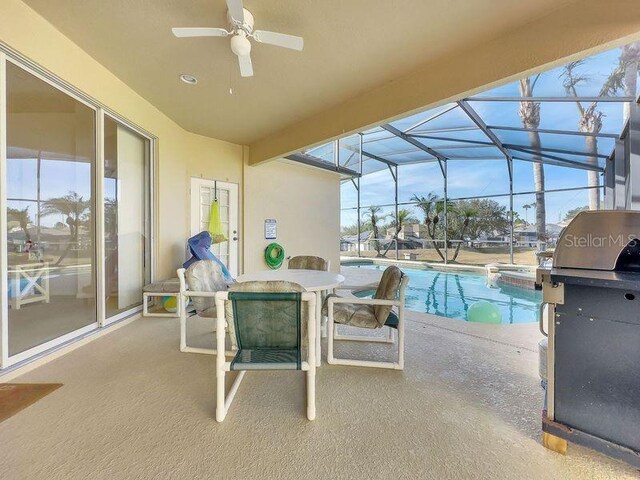 view of patio / terrace with a lanai and a grill