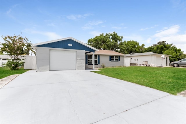 ranch-style home with a garage and a front lawn